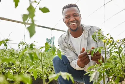 Young farmer in a greenhouse