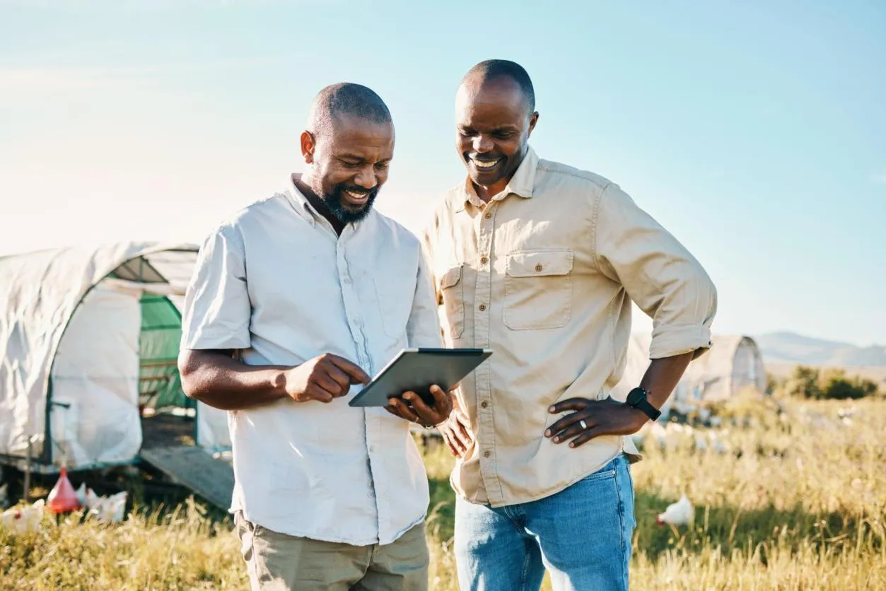 Agricultural professionals with a tablet